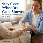 Female caregiver in a blue cardigan gently washing an elderly person's hand with a soapy white cleansing cloth while seated indoors. Text reads: Stay Clean When You Can't Shower – No Bath? No Running Water? No Problem.